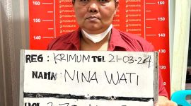 Tersangka kasus penipuan dan penggelapan modus calo Akpol, Nina Wati, saat diamankan polisi. Foto: Istimewa