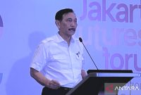 enteri Koordinator Bidang Maritim dan Investasi Luhut Binsar Pandjaitan dalam acara 