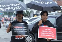 KKJ Sumut dan pegiat HAM di Kota Medan menggelar Aksi Kamisan mendesak penegakan hukum kasus dugaan pembunuhan wartawan Rico Sempurna Pasaribu. Foto: KKJ Sumut