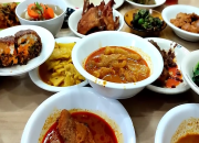 Hidangan autentik Nasi Kapau Hj Uni Emi Medan di ruko Jalan Rotan Baru 82/83, rumah makan Minang legendaris sejak 1982 dengan menu favorit gulai kepala kakap merah, tambunsu, dan sayur nangka khas Kapau.