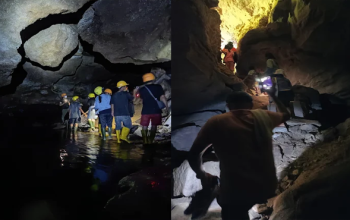 Wisatawan menjelajahi lorong bawah tanah beraliran air di Seribu Goa Banuarea, Humbang Hasundutan, Sumatera Utara, saat aktivitas susur goa (caving) di kawasan goa kapur yang masih alami.