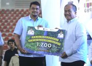 Peringatan May Day 2026, Bupati Asahan Terima 1.700 Kartu BPJS Ketenagakerjaan