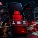 Ancaman keamanan siber berupa malware Rokarolla Android yang dapat menyusup ke perangkat melalui aplikasi palsu dan mencuri data pribadi pengguna.